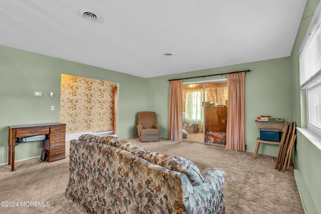 carpeted living room with a baseboard radiator