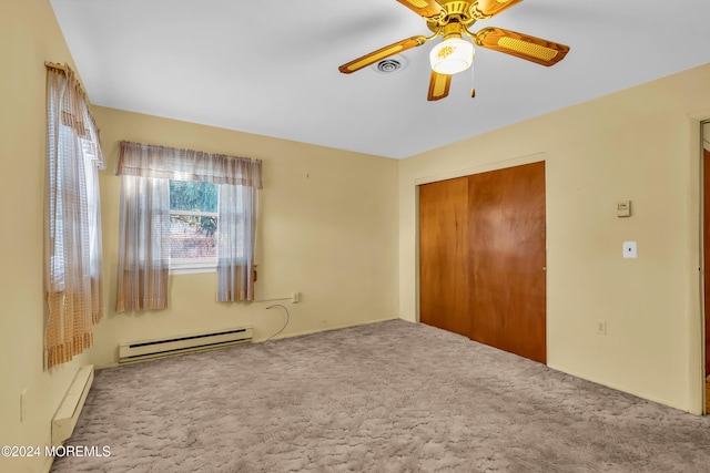 unfurnished bedroom featuring carpet, ceiling fan, a closet, and a baseboard radiator