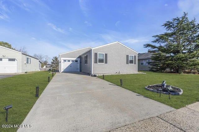 view of front of property featuring a garage and a front yard