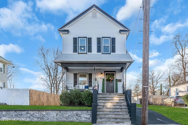 view of property featuring covered porch