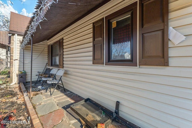 view of property exterior with a porch