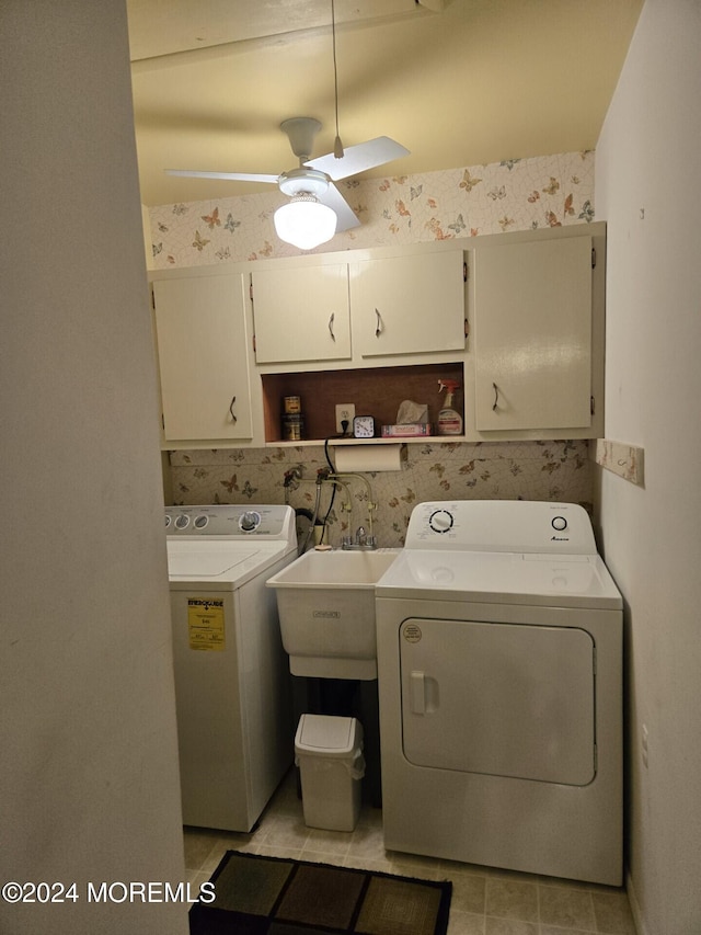 washroom with separate washer and dryer, ceiling fan, sink, and cabinets