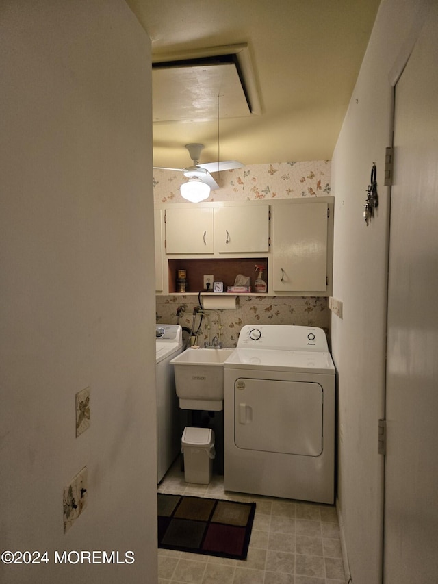 clothes washing area featuring cabinets, sink, washer and dryer, and ceiling fan