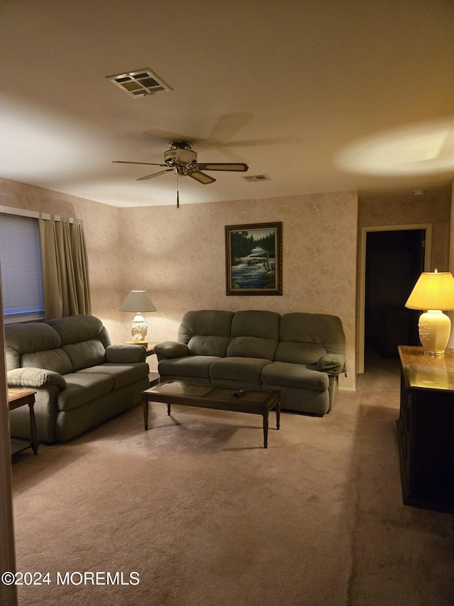 carpeted living room featuring ceiling fan