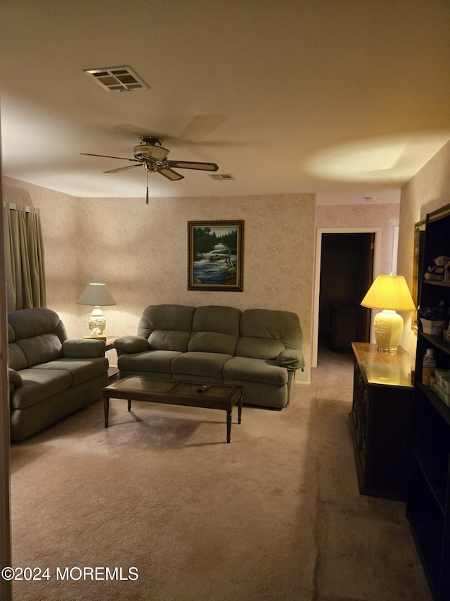 living room with carpet flooring and ceiling fan