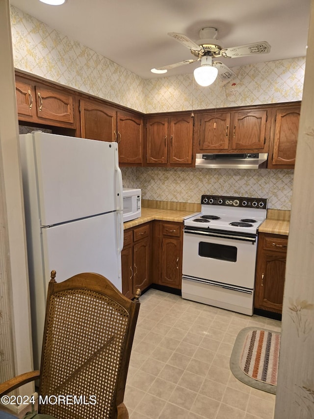 kitchen with ceiling fan and white appliances