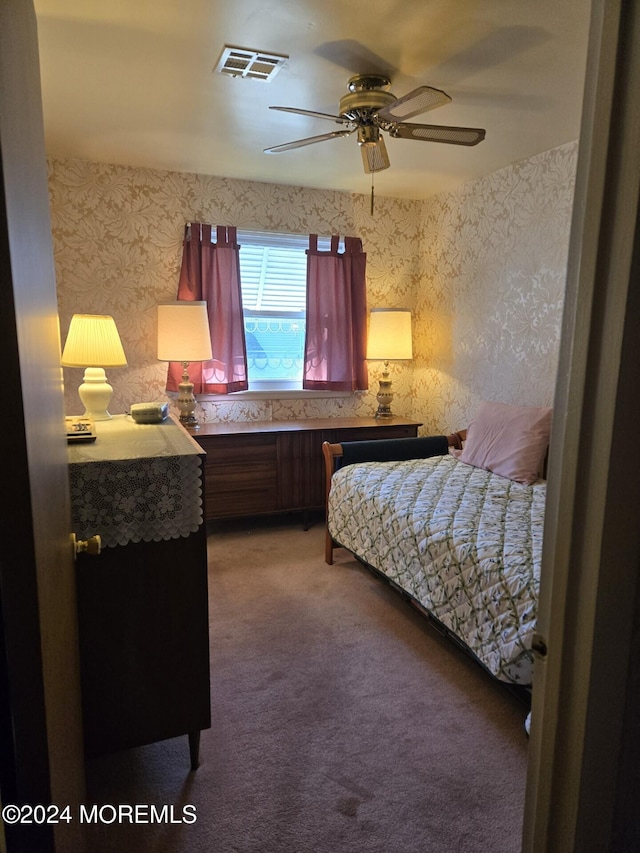 carpeted bedroom with ceiling fan