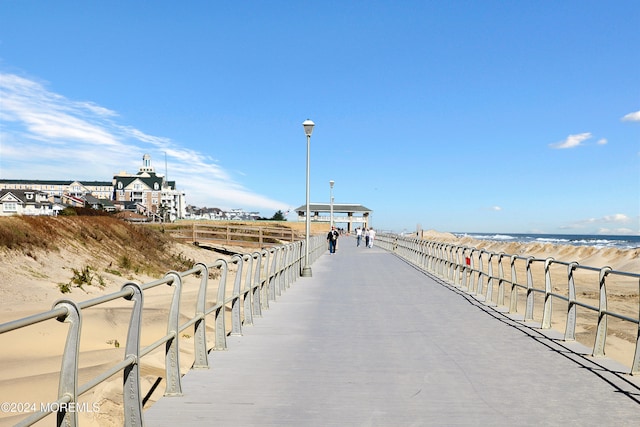 dock area with a view of the beach and a water view