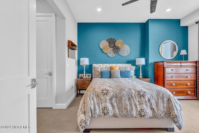 bedroom featuring light carpet and ceiling fan