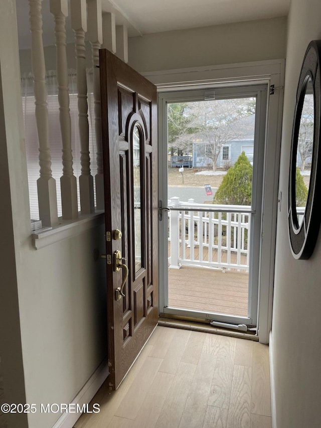 doorway featuring wood finished floors