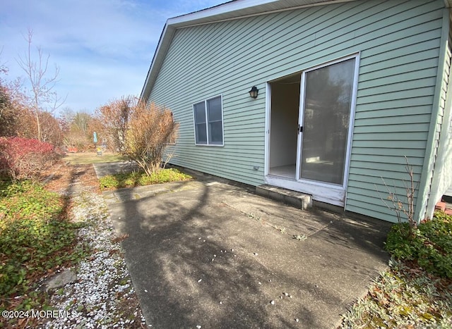 view of side of property featuring a patio