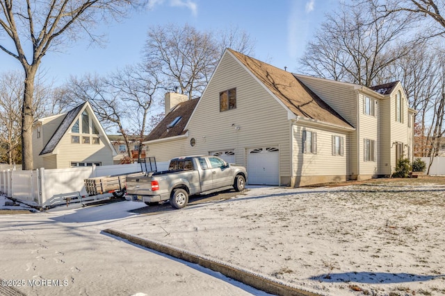 view of side of property featuring a garage