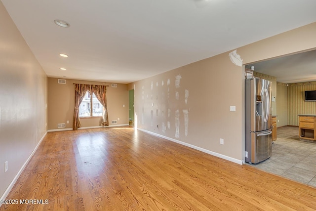 unfurnished room featuring light hardwood / wood-style floors