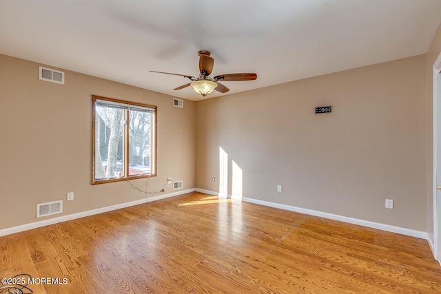 unfurnished room with ceiling fan and light hardwood / wood-style flooring