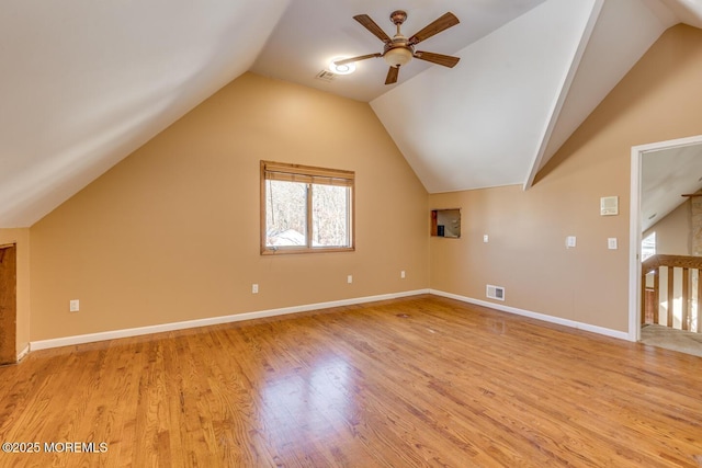 additional living space with ceiling fan, vaulted ceiling, and light wood-type flooring