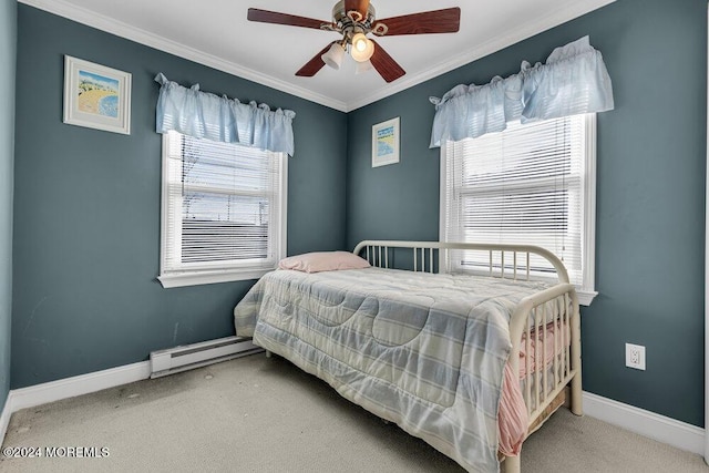 bedroom featuring baseboard heating, multiple windows, ceiling fan, and carpet