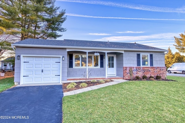 ranch-style house with a garage and a front yard