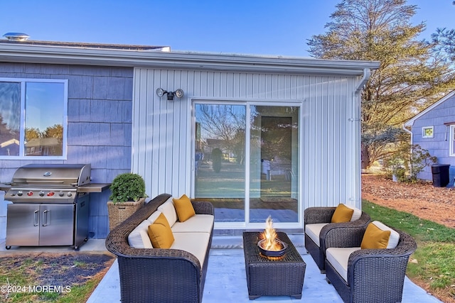 view of patio / terrace featuring a grill and an outdoor living space with a fire pit