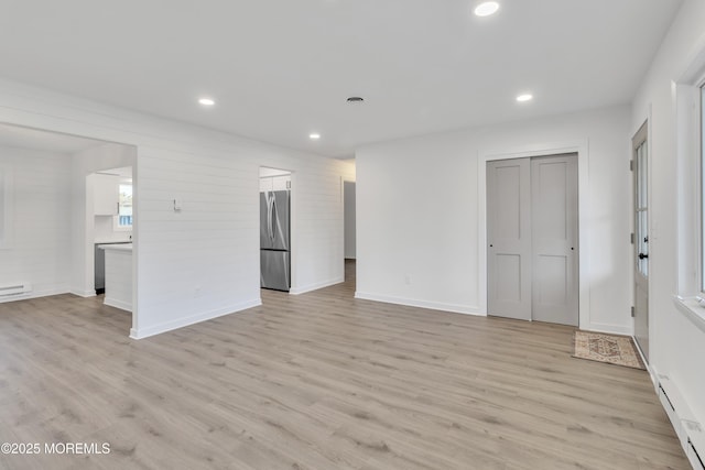 spare room featuring light wood-type flooring