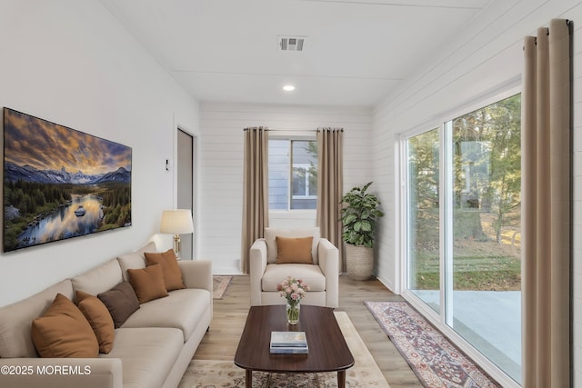 living room with light hardwood / wood-style flooring