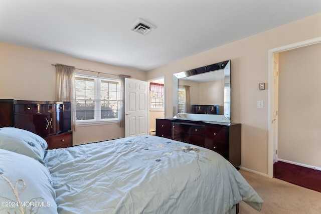 bedroom featuring light colored carpet