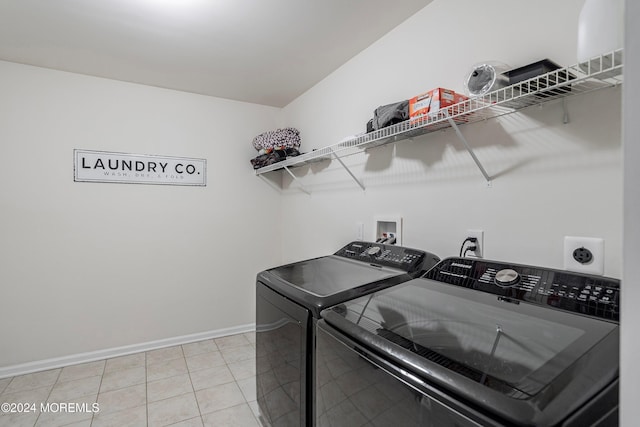 laundry area featuring tile patterned flooring and independent washer and dryer