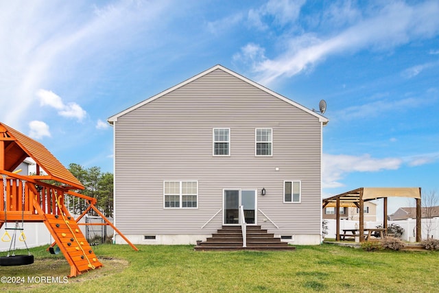 rear view of property with a playground and a lawn