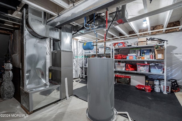 utility room with heating unit and gas water heater