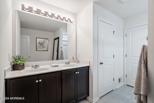 bathroom featuring tile patterned floors and vanity