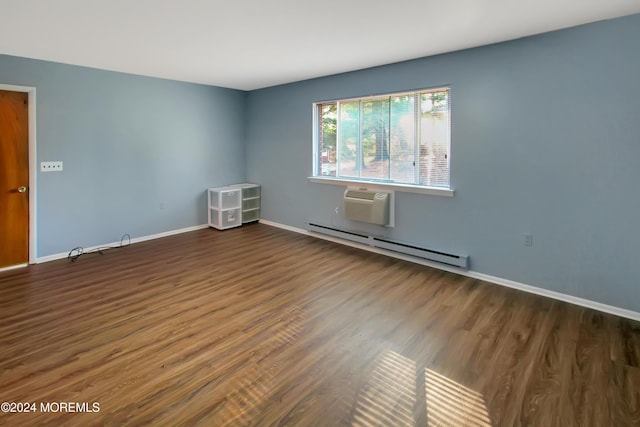 empty room featuring a wall mounted air conditioner, dark hardwood / wood-style flooring, and a baseboard radiator