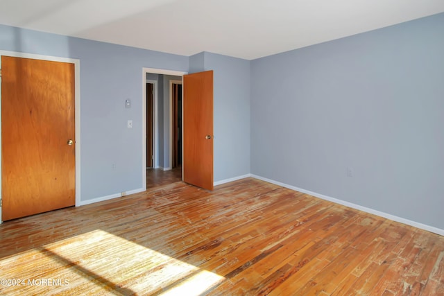 empty room with light hardwood / wood-style floors