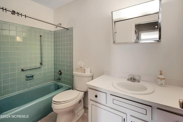 full bathroom with tiled shower / bath combo, toilet, and vanity