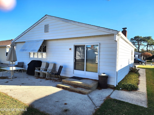 back of house featuring a patio