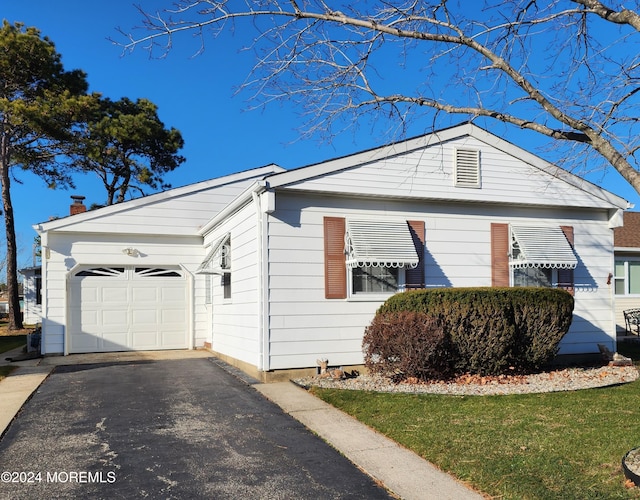 view of property exterior with a garage