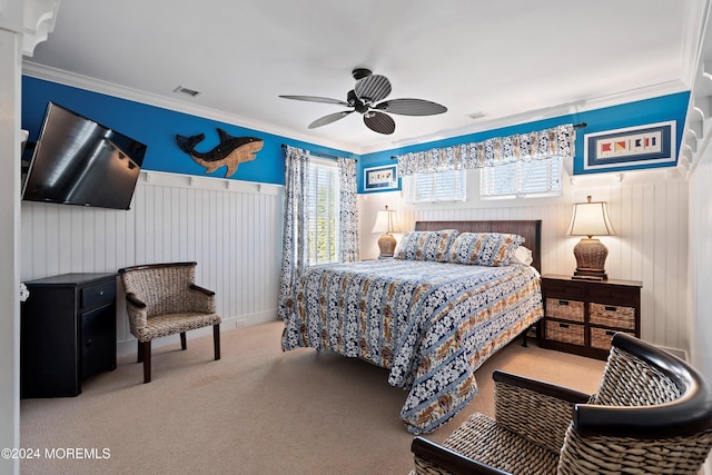 bedroom with ceiling fan, light colored carpet, and crown molding