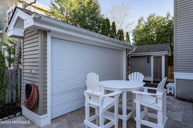 view of patio featuring a shed