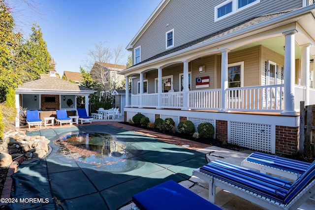 view of swimming pool with a patio and an outdoor structure