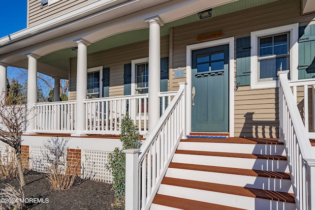 property entrance featuring covered porch