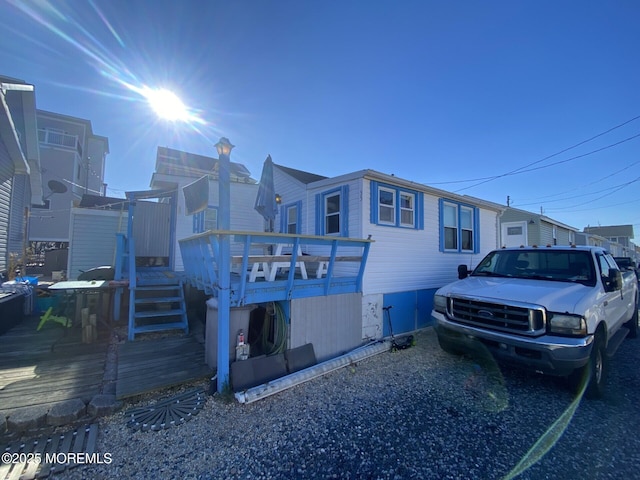 view of front of home with a wooden deck