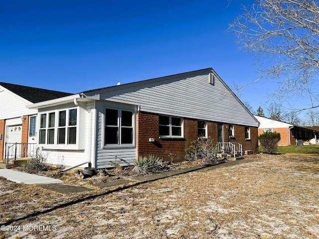 view of side of home with a garage