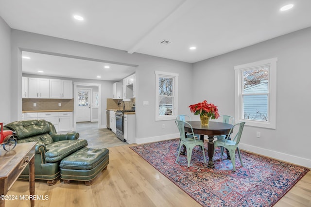 dining space featuring light hardwood / wood-style floors