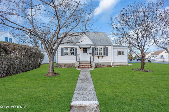 view of front of home with a front lawn