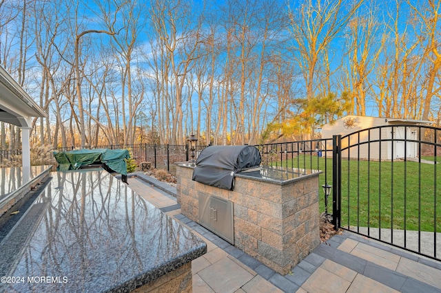 view of patio featuring a grill and exterior kitchen