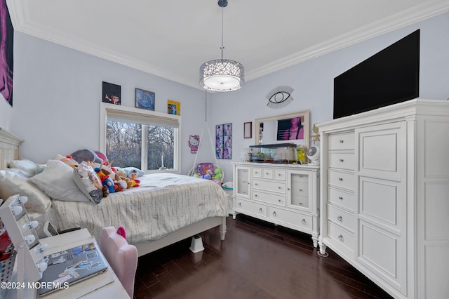 bedroom with dark hardwood / wood-style flooring and ornamental molding