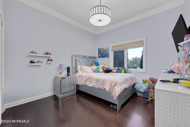 bedroom with dark hardwood / wood-style flooring and crown molding