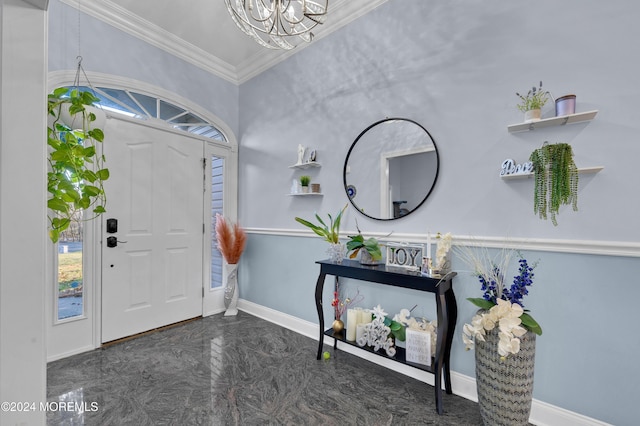 entrance foyer featuring ornamental molding and a chandelier