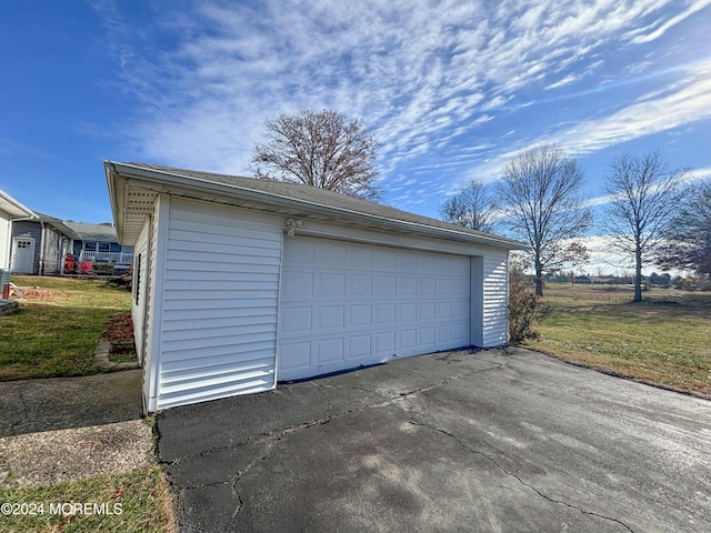 garage with a lawn