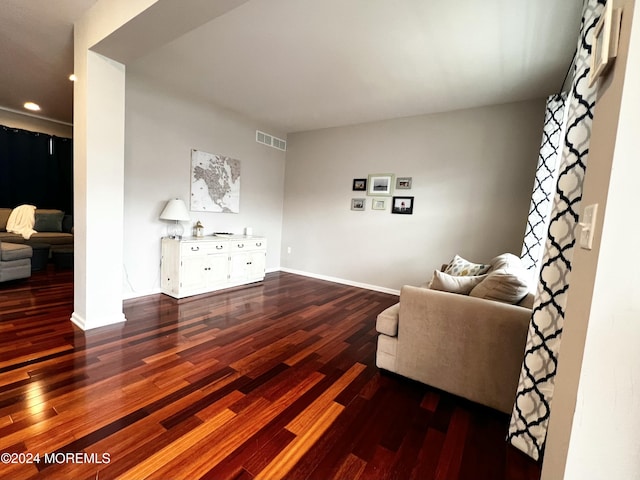 living room featuring dark hardwood / wood-style flooring