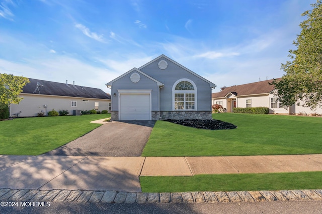 single story home with a garage, central air condition unit, and a front lawn