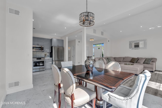 dining area with a notable chandelier